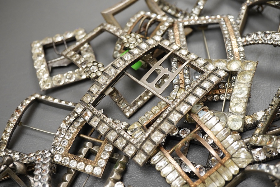 A large collection of shoe buckles, 18th-19th century, of rectangular outline, set with pastes, mostly mounted in steel, a minority in silver, some with later brooch fittings